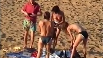 Nudist family leaving the beach