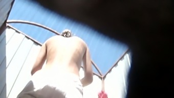 Slender white caramel skin babe in the beach cabin filmed nude from behind