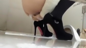Woman in high heels caught in public toilet pissing
