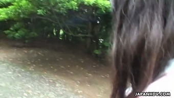 Cute naughty Japanese girl Riko Tanabe is sucking big dick in the park