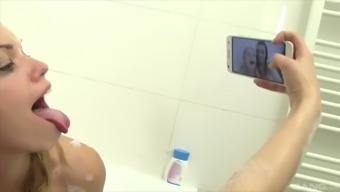 cute lesbian babes enjoy a hot fuck during a bubble bath