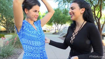 Sweet girlfriends play with each other's bodies in public