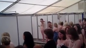 A crowd of women in public shower
