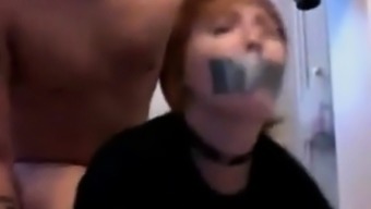 Sexy babe with ducttaped mouth fucked