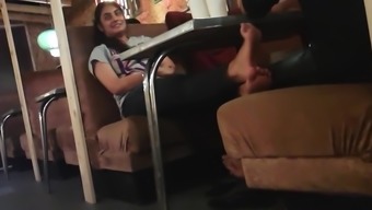 Candid feet of indian girl in cafe