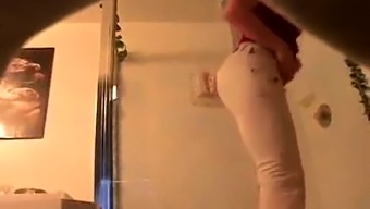 Kinky voyeur captures a desirable brunette taking a shower