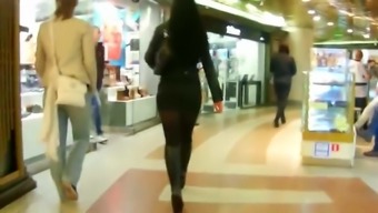 Russian woman in short skirt and high heel boots spying