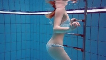 Incredible underwater striptease show performed by redhead Diana Zelenkina