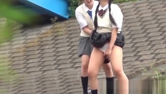 Outside pissing competition with two young Japanese pupils