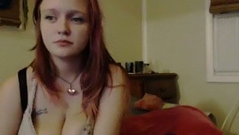 This redhead smokes a lot and she likes to expose her magnificent big tits