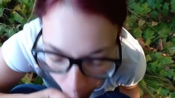 Public Blowing By A Redhead Teen Near A Church In The Woods