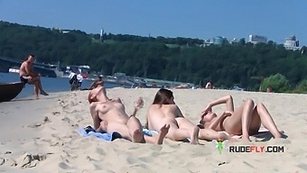 Wicked young nudist enjoys being topless at the beach