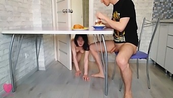 Step sister quietly climbed under the table and sucked his brother's cock while he eat