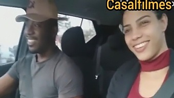 Couple in the car, the husband puts his wife to breastfeed and drinks milk