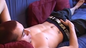 Luke Daniels lays back on the couch while watching a porn video on TV. He starts stroking his huge cock and soon gets a helping hand. Lukes ass is fingered and stuffed with a sex toy, until he pumps out cum awesome. load.