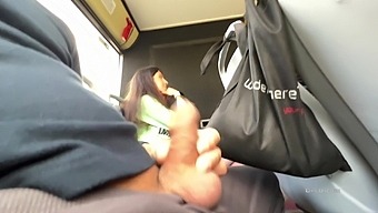 HD video of a dark-haired girl giving a handjob in public