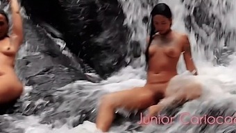 Busty Latina and big natural tits Latina get wet and wild at waterfall