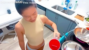 Asian wife cooks up a storm in front of her husband